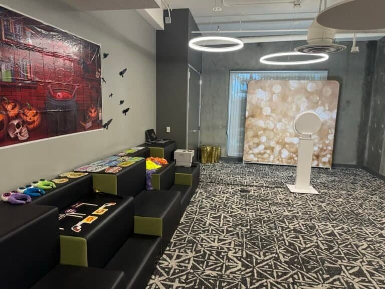 Selfie photo booth with backdrop and props set up in an office