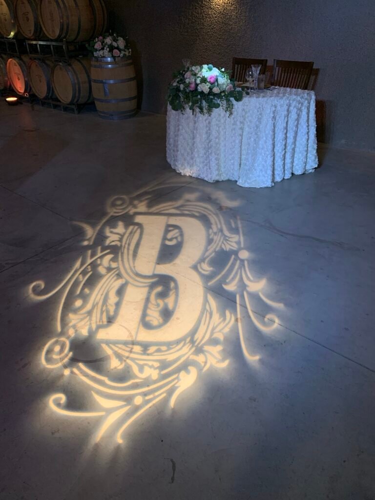Custom monogram light projected on the dance floor