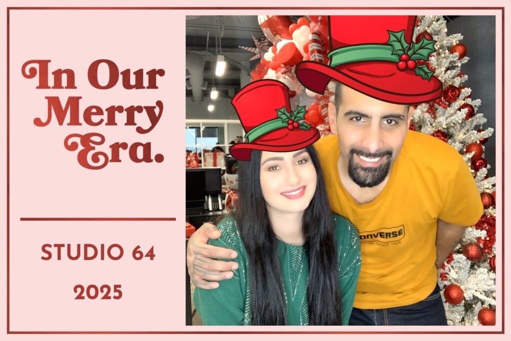 Couple in top hats by the Christmas tree, selfie photo booth picture