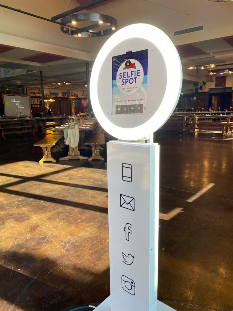 Selfie photo booth set up in a large event hall