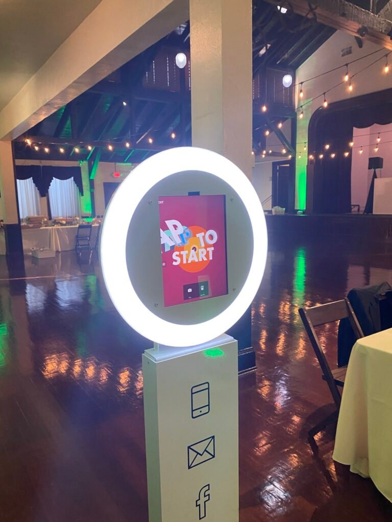 Selfie photo booth with a glowing ring light in a ballroom